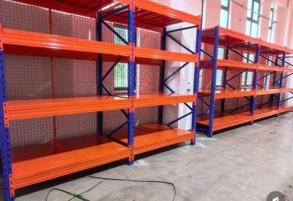 Custom industrial metal shelving with steel shelf panels and protective wire mesh backing