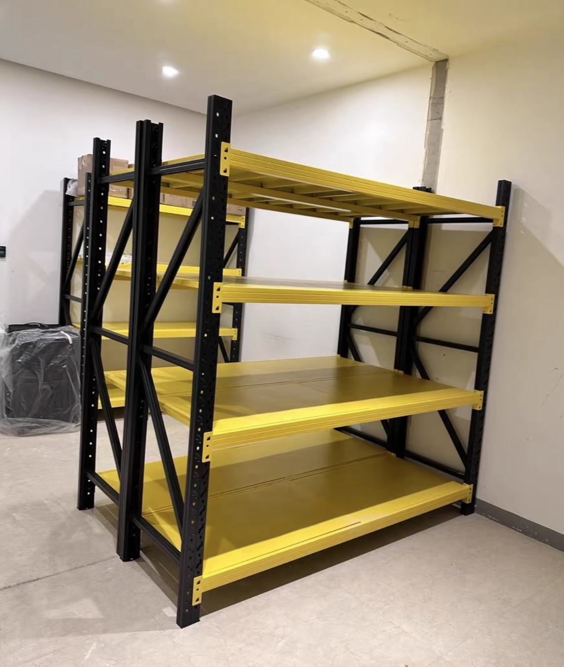 Black and yellow heavy-duty adjustable steel shelving for garage workshop and warehouse storage (4) Black and yellow heavy-duty adjustable steel shelving for garage workshop and warehouse storage (4)