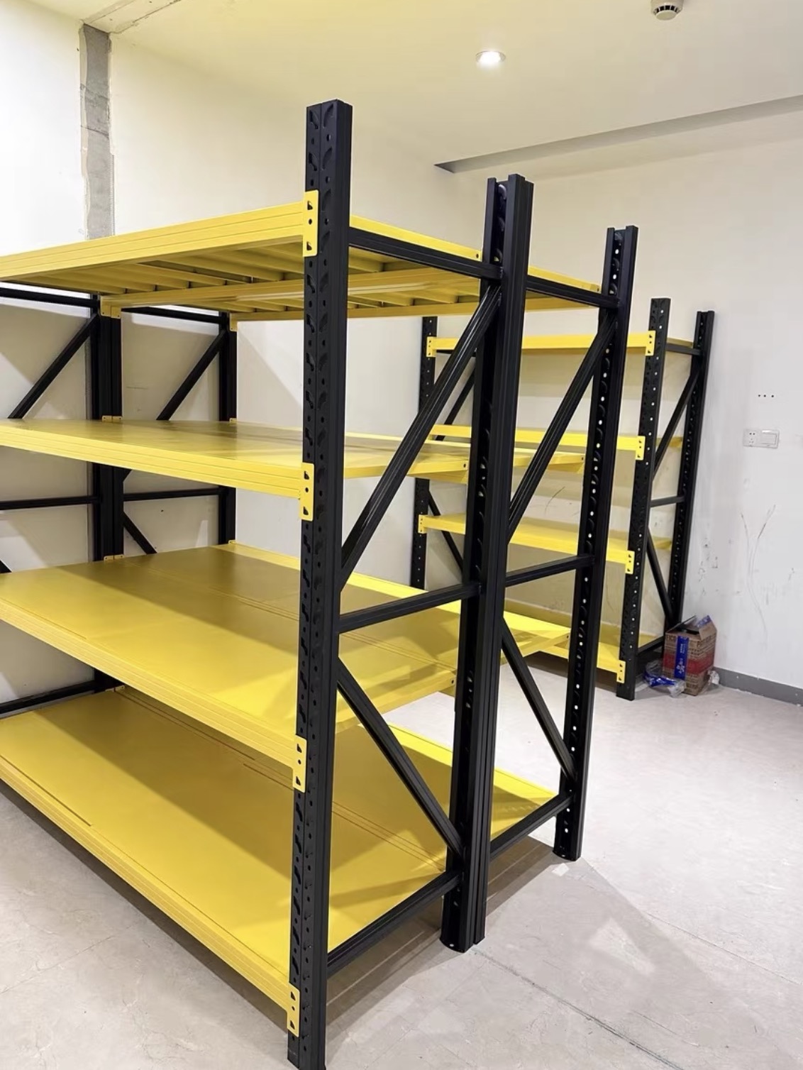 Black and yellow heavy-duty adjustable steel shelving for garage workshop and warehouse storage (3) Black and yellow heavy-duty adjustable steel shelving for garage workshop and warehouse storage (3)