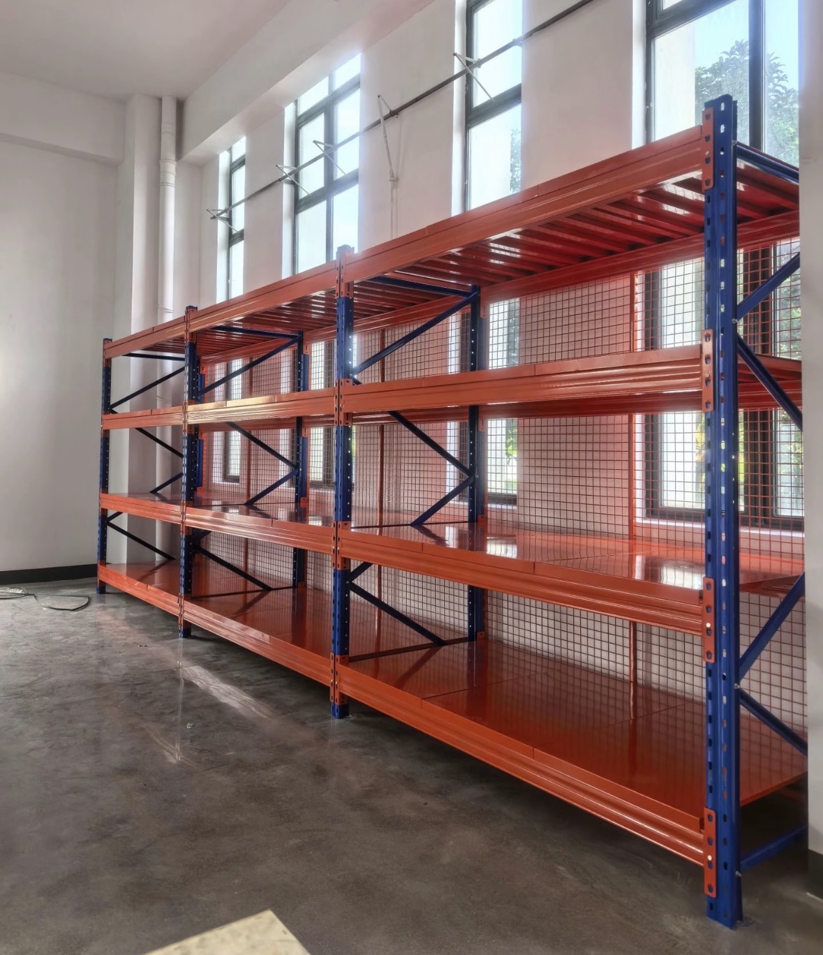 KAYOU industrial warehouse shelving layout with long orange steel shelf rows