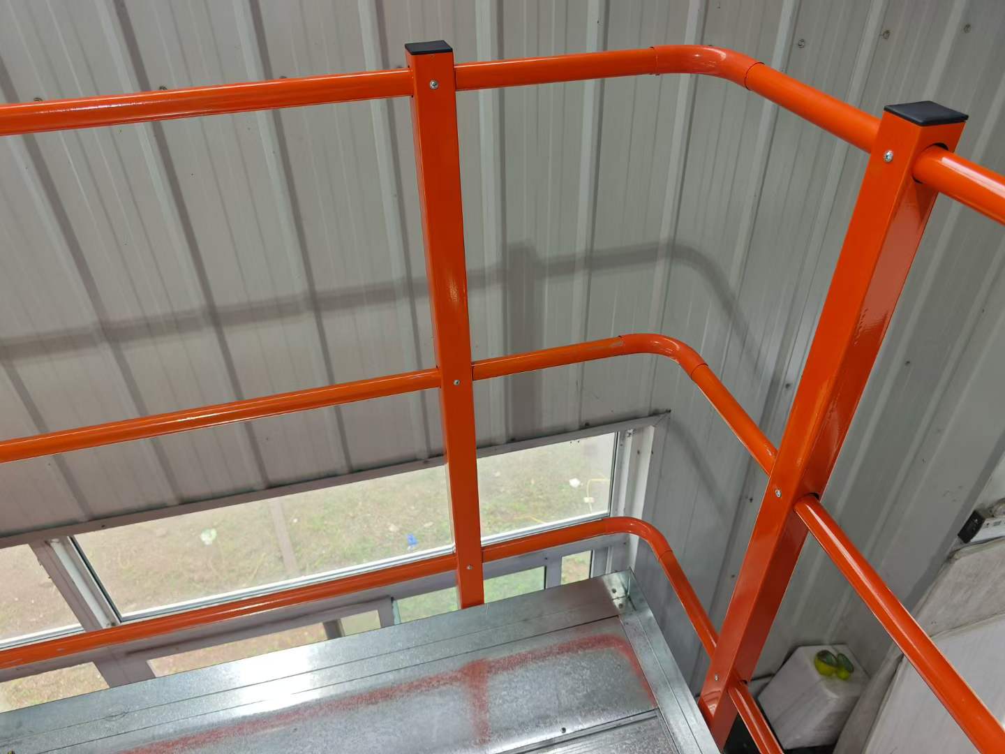 steel mezzanine project 5 Installed KAYOU steel mezzanine platform with columns and warehouse operations below